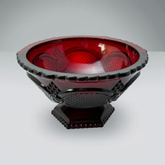 Vintage Avon ruby red glass compote with scalloped rim and pedestal base, featuring embossed Cape Cod pattern and rich crimson hue; a collectible 1970s–1990s candy dish styled for festive tables or vintage decor.