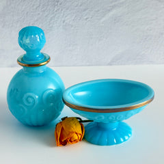 Vintage Avon turquoise opalite glass bottle and matching footed soap dish with gold‑tone trim.