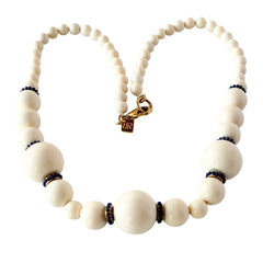 Vintage Banana Republic cream Lucite bead necklace with blue glass bead rondelles and gold‑tone clasp, signed BR.