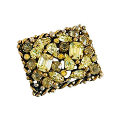 A vintage Barclay gold‑tone brooch set with jonquil rhinestones in mixed cuts, shown from various angles to display its shape, details, and condition.
