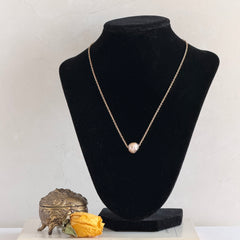 Vintage gold‑filled necklace with a beige baroque pearl pendant.