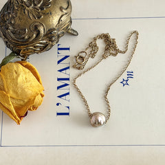 Vintage gold‑filled necklace with a beige baroque pearl pendant.