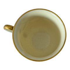 Vintage Black Knight Hohenberg Bavaria porcelain demi-tasse teacup in Monceau pattern; white base with multicolored floral design, teal and gold scrollwork near rim, and gold-trimmed handle and pedestal base.