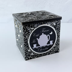 French black matelassé metal tea cube tin with silver accents and a pink teapot motif by Moldeo
