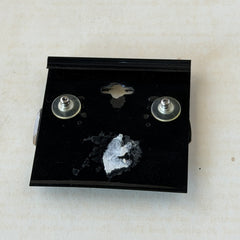 Vintage 1980s black and white enamel geometric hexagonal post earrings with silver tone and abstract motifs, with on original Impressions card.