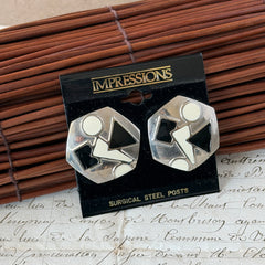 Vintage 1980s black and white enamel geometric hexagonal post earrings with silver tone and abstract motifs, with on original Impressions card.