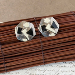Vintage 1980s black and white enamel geometric hexagonal post earrings with silver tone and abstract motifs, with on original Impressions card.