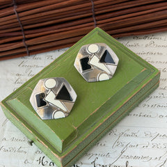 Vintage 1980s black and white enamel geometric hexagonal post earrings with silver tone and abstract motifs, with on original Impressions card.