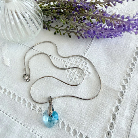 Vintage light blue faceted crystal heart pendant on a silver tone chain, 1990s French necklace.