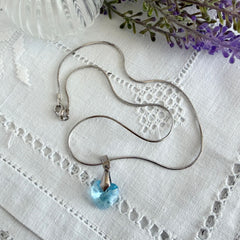 Vintage light blue faceted crystal heart pendant on a silver tone chain, 1990s French necklace.