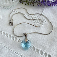 Vintage light blue faceted crystal heart pendant on a silver tone chain, 1990s French necklace.
