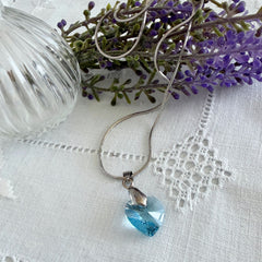 Vintage light blue faceted crystal heart pendant on a silver tone chain, 1990s French necklace.