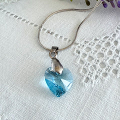 Vintage light blue faceted crystal heart pendant on a silver tone chain, 1990s French necklace.