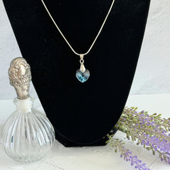 Vintage light blue faceted crystal heart pendant on a silver tone chain, 1990s French necklace.