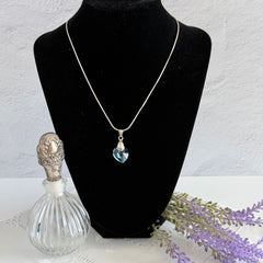 Vintage light blue faceted crystal heart pendant on a silver tone chain, 1990s French necklace.