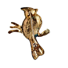 Vintage blue and green enamel gold‑tone bird brooch perched on a branch, shown from multiple angles.