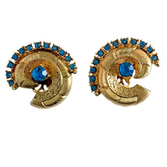 Vintage 1980s textured gold tone spiral clip-on earrings with blue rhinestones.