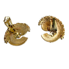 Vintage 1980s textured gold tone spiral clip-on earrings with blue rhinestones.