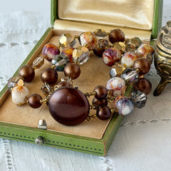 Vintage 3‑strand bracelet with Aurum and Vitrail crystal beads, faux jasper art glass beads, and shiny brown beads in gold tone