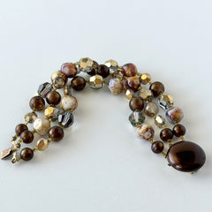 Vintage 3‑strand bracelet with Aurum and Vitrail crystal beads, faux jasper art glass beads, and shiny brown beads in gold tone