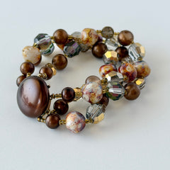 Vintage 3‑strand bracelet with Aurum and Vitrail crystal beads, faux jasper art glass beads, and shiny brown beads in gold tone