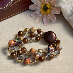 Vintage 3‑strand bracelet with Aurum and Vitrail crystal beads, faux jasper art glass beads, and shiny brown beads in gold tone