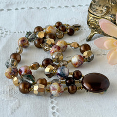 Vintage 3‑strand bracelet with Aurum and Vitrail crystal beads, faux jasper art glass beads, and shiny brown beads in gold tone