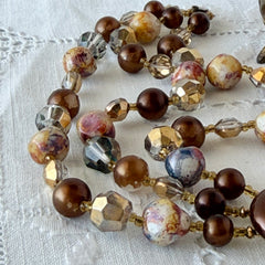 Vintage 3‑strand bracelet with Aurum and Vitrail crystal beads, faux jasper art glass beads, and shiny brown beads in gold tone