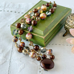 Vintage 3‑strand bracelet with Aurum and Vitrail crystal beads, faux jasper art glass beads, and shiny brown beads in gold tone