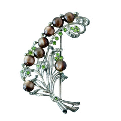 Vintage 1930s floral spray brooch with brown moonglow cabochons and green rhinestones in silver‑tone pot metal.