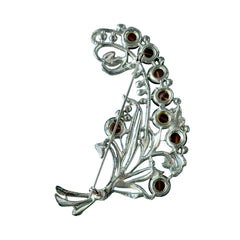 Vintage 1930s floral spray brooch with brown moonglow cabochons and green rhinestones in silver‑tone pot metal.