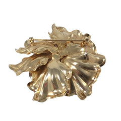 Vintage Bugbee & Niles brushed gold tone flower brooch with pink, aqua, and clear rhinestones, shown from multiple angles to highlight its dimensional petals and detailed construction.
