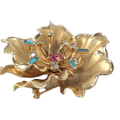 Vintage Bugbee & Niles brushed gold tone flower brooch with pink, aqua, and clear rhinestones, shown from multiple angles to highlight its dimensional petals and detailed construction.