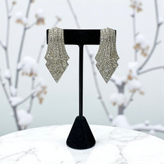 Vintage Carolee clip-on earrings with silver-tone Art Deco design and clear pave rhinestones; signed and in very good condition, circa 1980s.