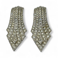 Vintage Carolee clip-on earrings with silver-tone Art Deco design and clear pave rhinestones; signed and in very good condition, circa 1980s.