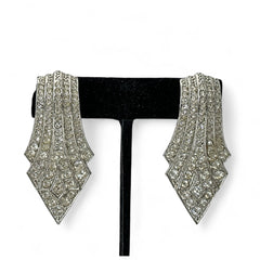 Vintage Carolee clip-on earrings with silver-tone Art Deco design and clear pave rhinestones; signed and in very good condition, circa 1980s.