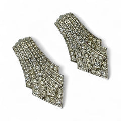 Vintage Carolee clip-on earrings with silver-tone Art Deco design and clear pave rhinestones; signed and in very good condition, circa 1980s.