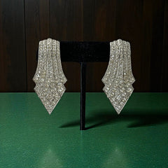 Vintage Carolee clip-on earrings with silver-tone Art Deco design and clear pave rhinestones; signed and in very good condition, circa 1980s.