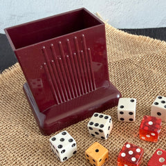 Vintage maroon Carvanite Shuffle Cut card shuffler by Lea Industries, shown on burlap fabric.