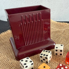 Vintage maroon Carvanite Shuffle Cut card shuffler by Lea Industries, shown on burlap fabric.