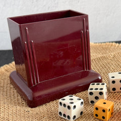 Vintage maroon Carvanite Shuffle Cut card shuffler by Lea Industries, shown on burlap fabric.