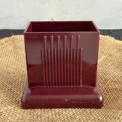 Vintage maroon Carvanite Shuffle Cut card shuffler by Lea Industries, shown on burlap fabric.