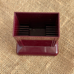Vintage maroon Carvanite Shuffle Cut card shuffler by Lea Industries, shown on burlap fabric.