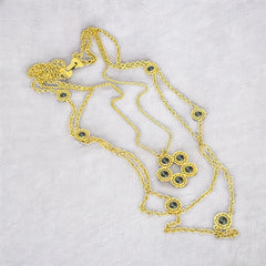 Vintage Celebrity gold‑tone necklace with gray glass chicklet elements, featuring a five‑round floral pendant and multiple convertible strands.