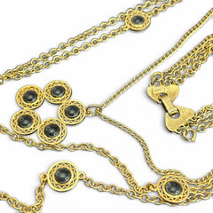 Vintage Celebrity gold‑tone necklace with gray glass chicklet elements, featuring a five‑round floral pendant and multiple convertible strands.