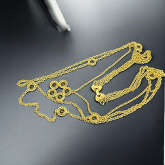 Vintage Celebrity gold‑tone necklace with gray glass chicklet elements, featuring a five‑round floral pendant and multiple convertible strands.