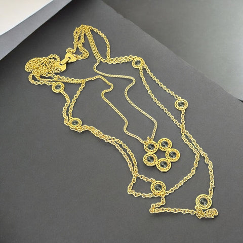 Vintage Celebrity gold‑tone necklace with gray glass chicklet elements, featuring a five‑round floral pendant and multiple convertible strands.