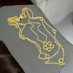 Vintage Celebrity gold‑tone necklace with gray glass chicklet elements, featuring a five‑round floral pendant and multiple convertible strands.