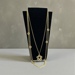 Vintage Celebrity gold‑tone necklace with gray glass chicklet elements, featuring a five‑round floral pendant and multiple convertible strands.