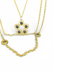 Vintage Celebrity gold‑tone necklace with gray glass chicklet elements, featuring a five‑round floral pendant and multiple convertible strands.